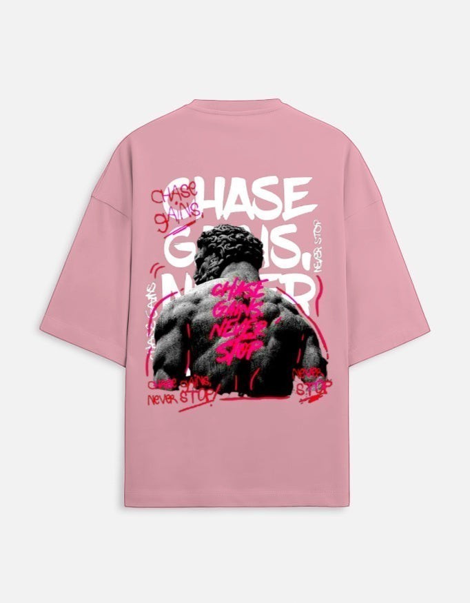 WYND pink oversized tee with graphic print of a muscular statue and graffiti text "CHASE GAINS NEVER STOP"